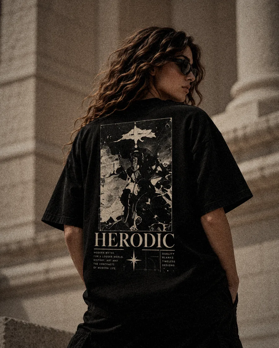 Model from behind in The Relic washed black tee beside stone columns