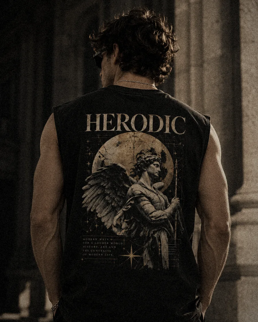 Model from behind in The Sentinel black boxy tank, winged statue and golden moon back print