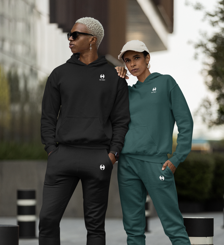 Couple wearing full Style & Comfort Black & Green Sets. Hoodies & Joggers. Female wearing size up joggers for oversized fit.